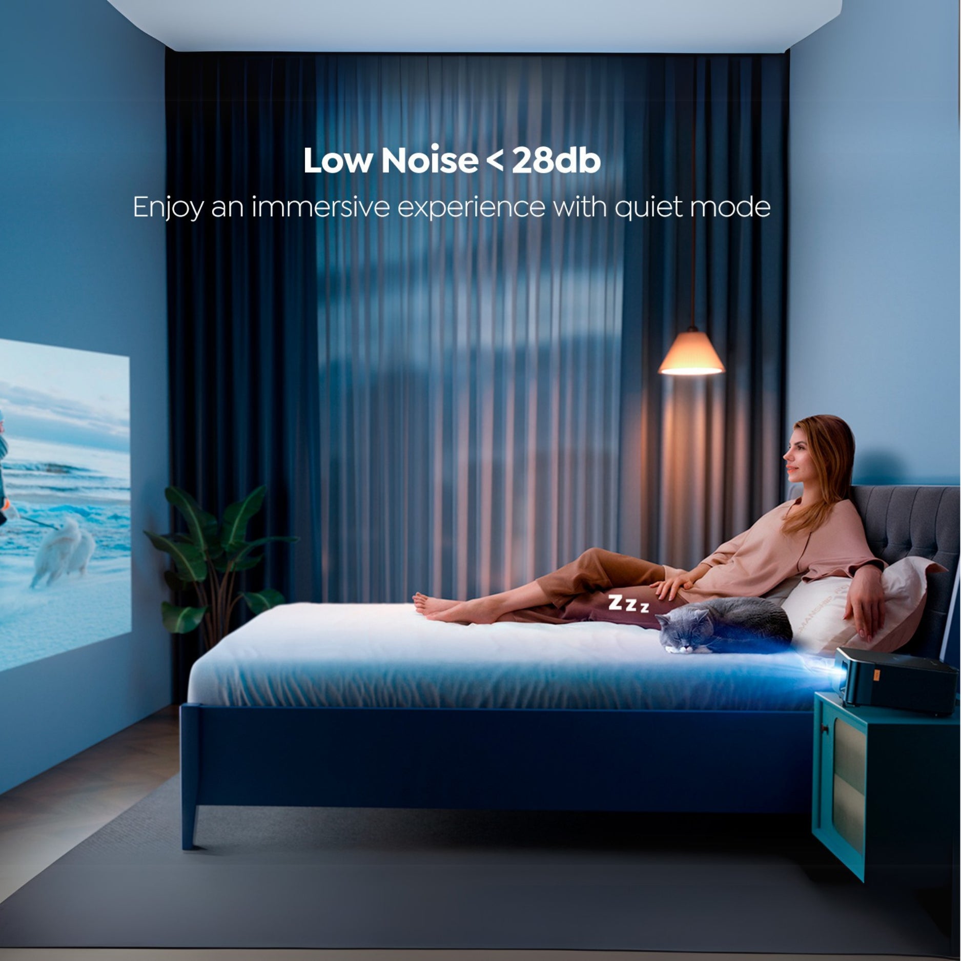 Woman relaxing on a bed in a bedroom with a projector screen displaying an ocean scene, featuring text about low noise levels.
