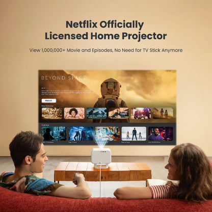 Two people sitting on a couch watching movies projected by a Netflix Yaber Projector L2 Plus